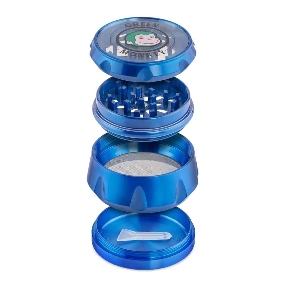 A slightly angled, close-up shot of the Baboon Crown 63mm Grinder, showcasing its multi-tiered metallic design.