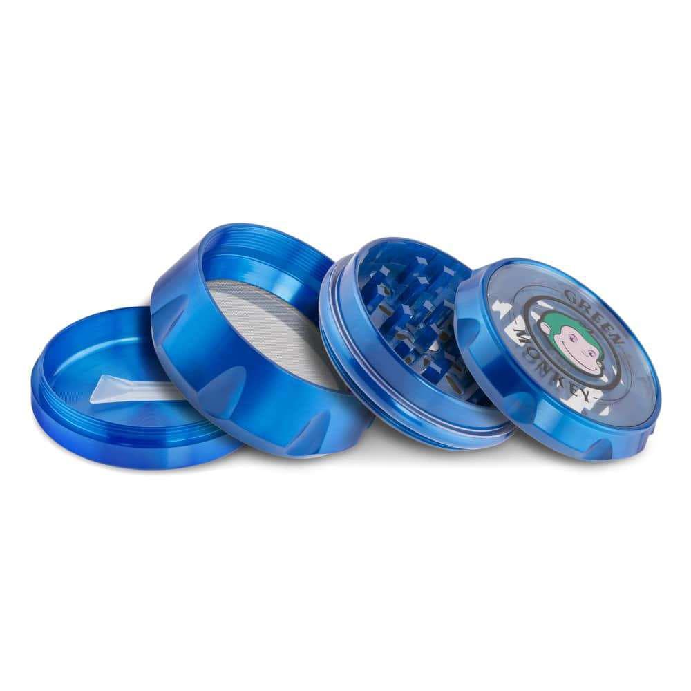 A disassembled view of the Baboon Crown 63mm Grinder, showcasing its metallic, multi-tiered construction against a neutral background.