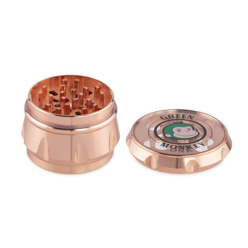 Top-down view of the Baboon Crown 63mm Grinder, showcasing its metallic finish and multi-tiered grinding teeth.