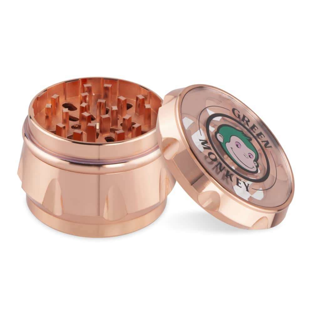 A close-up, angled view of the Baboon Crown 63mm Grinder, showcasing its metallic finish and multi-tiered grinding teeth.