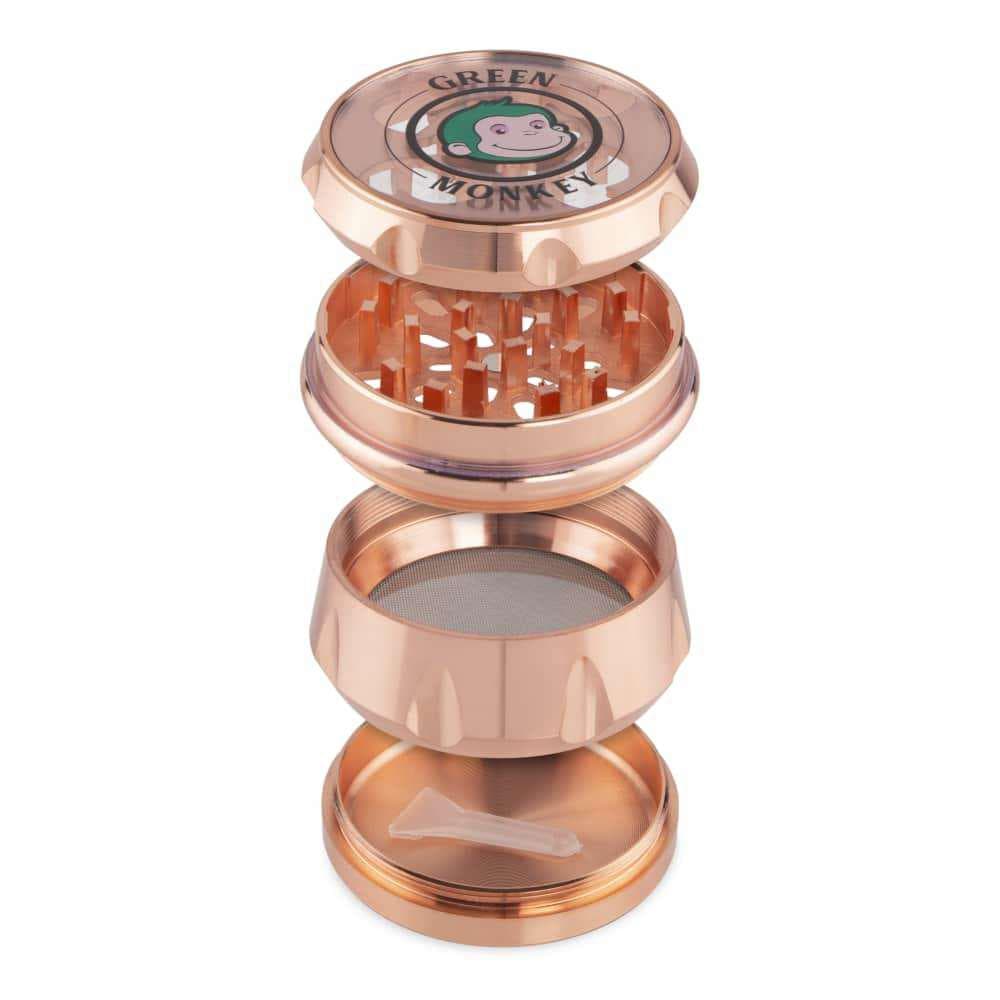 A disassembled view of the Baboon Crown 63mm Grinder, showcasing its metal components in a circular arrangement.