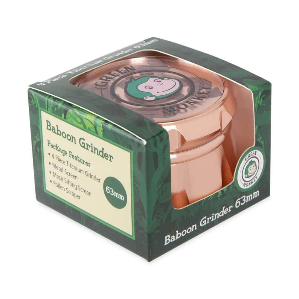 Front view of the Baboon Crown 63mm Grinder, showing a metallic, multi-tiered design with a branded label.