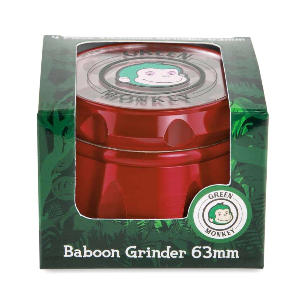 Front view of the Baboon Crown 63mm Grinder, showing the circular, multi-part metallic grinder against a green background.