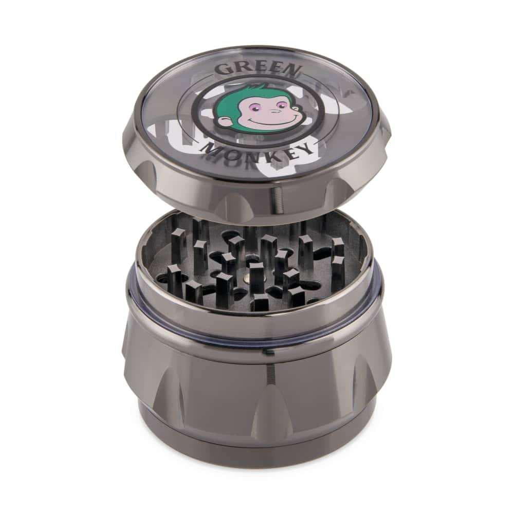 A close-up, angled view of the Baboon Crown 63mm Grinder with its lid partially removed, revealing the teeth inside.