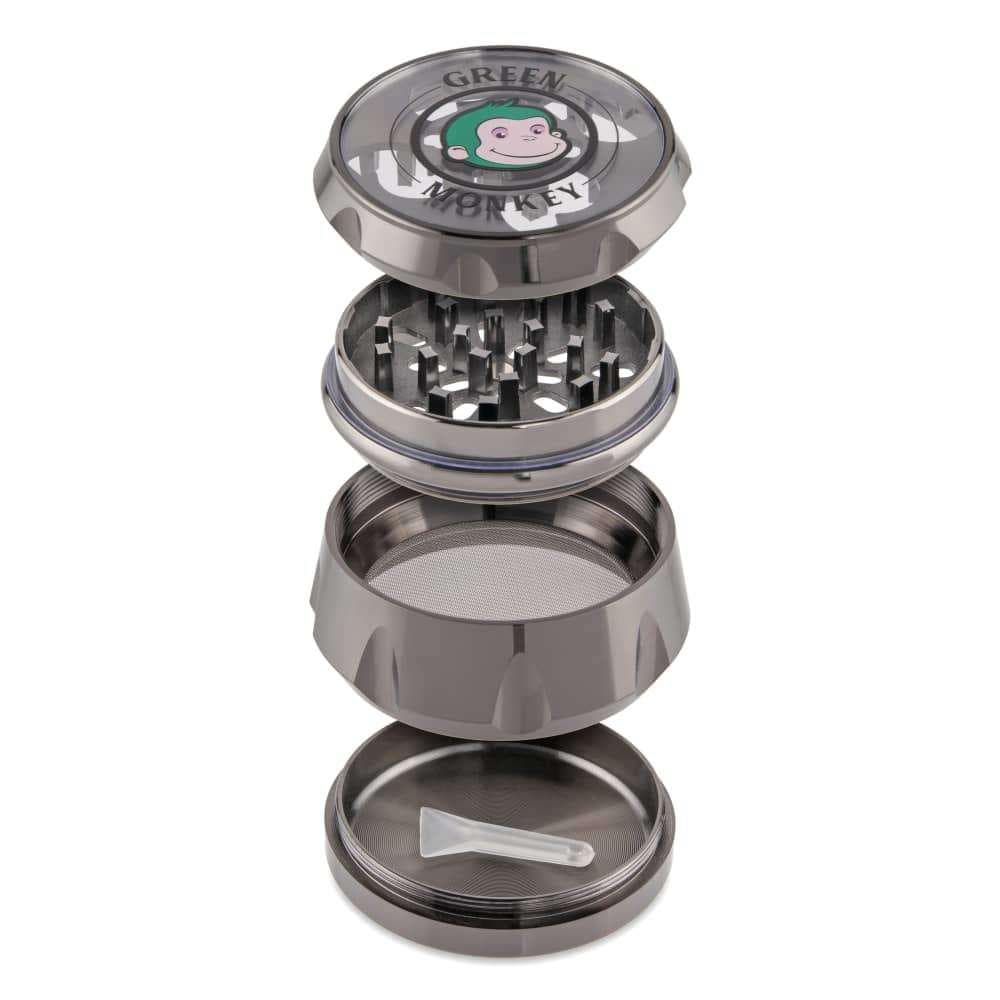 A disassembled view of the Baboon Crown 63mm Grinder, showing its metallic tiers stacked and revealing internal components.