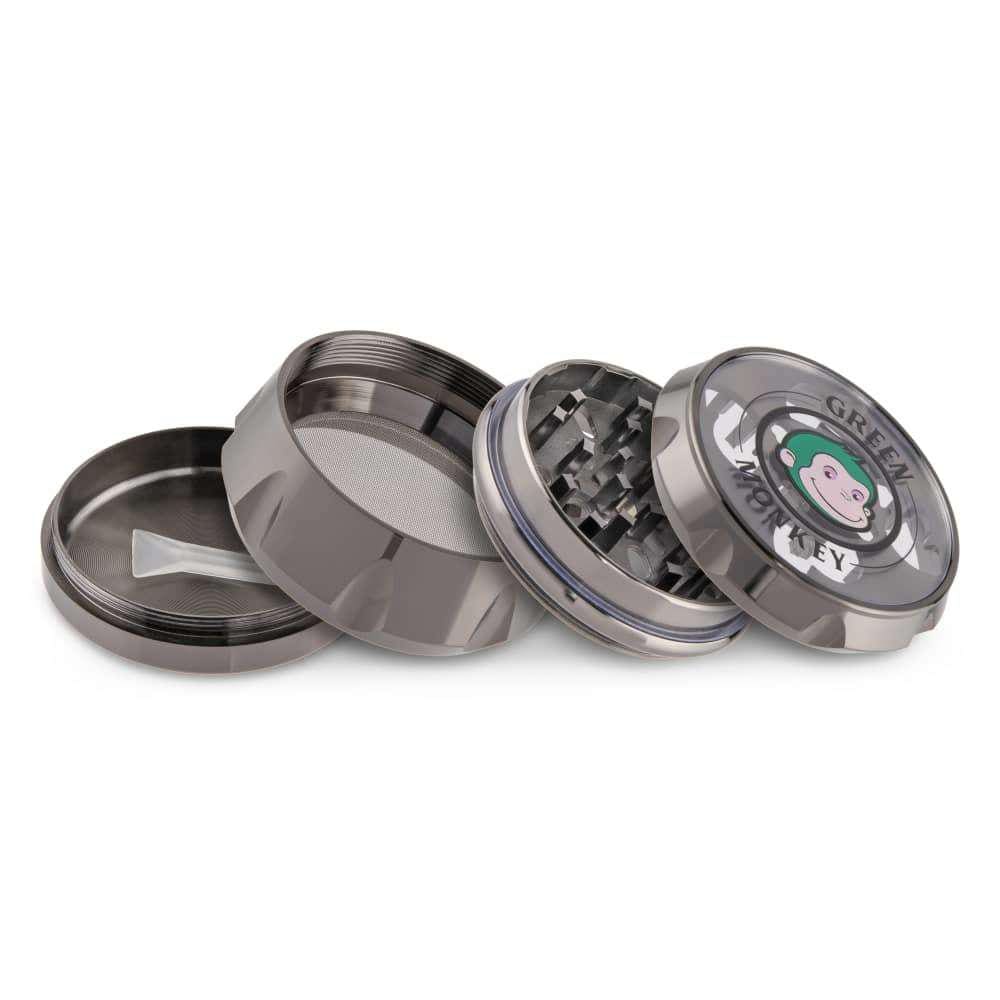 A disassembled Baboon Crown 63mm Grinder with its four pieces arranged in a slightly angled, top-down view against a neutral background.