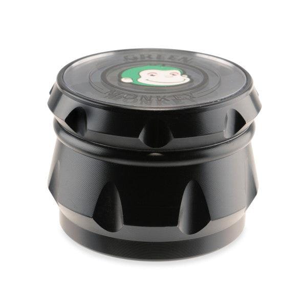 A close-up shot of the Baboon Crown 63mm Grinder, showcasing its metallic, multi-tiered design and circular shape.