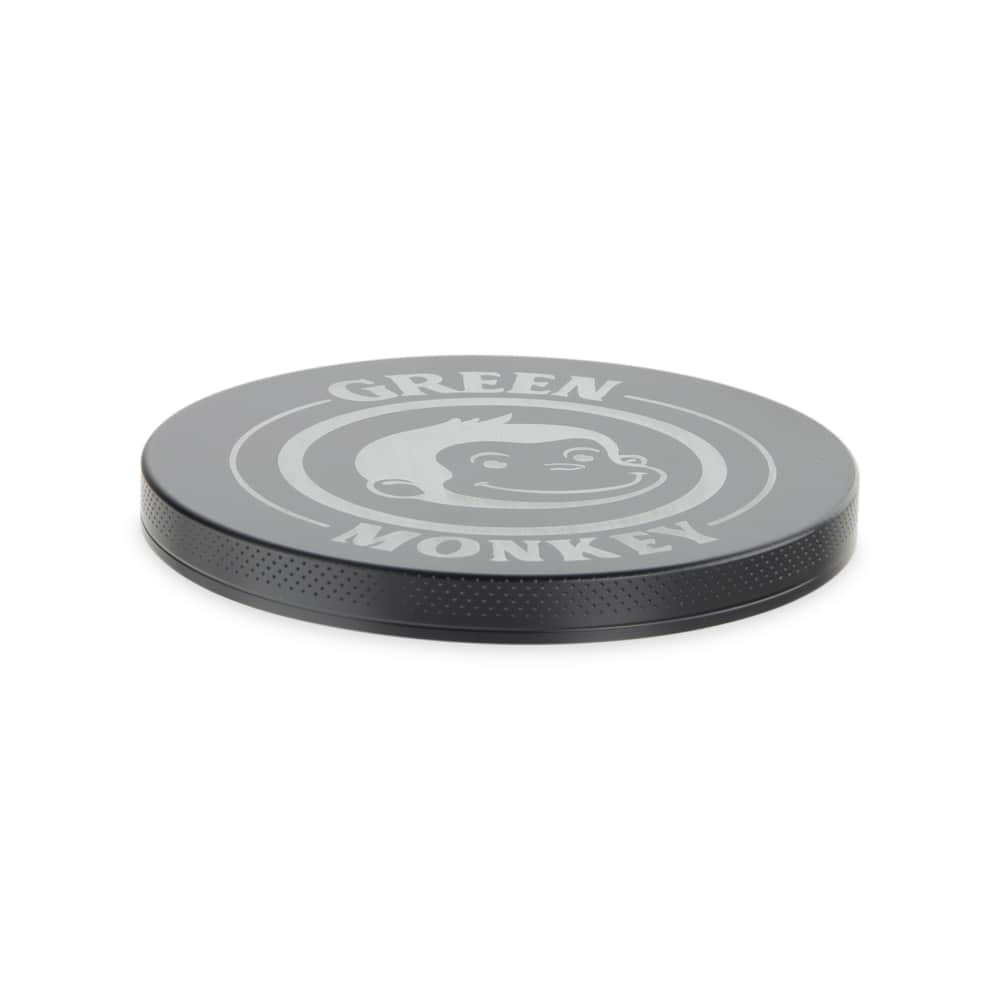 Top-down view of the Capuchin 100mm Grinder, showcasing its circular, metallic surface and clean design.