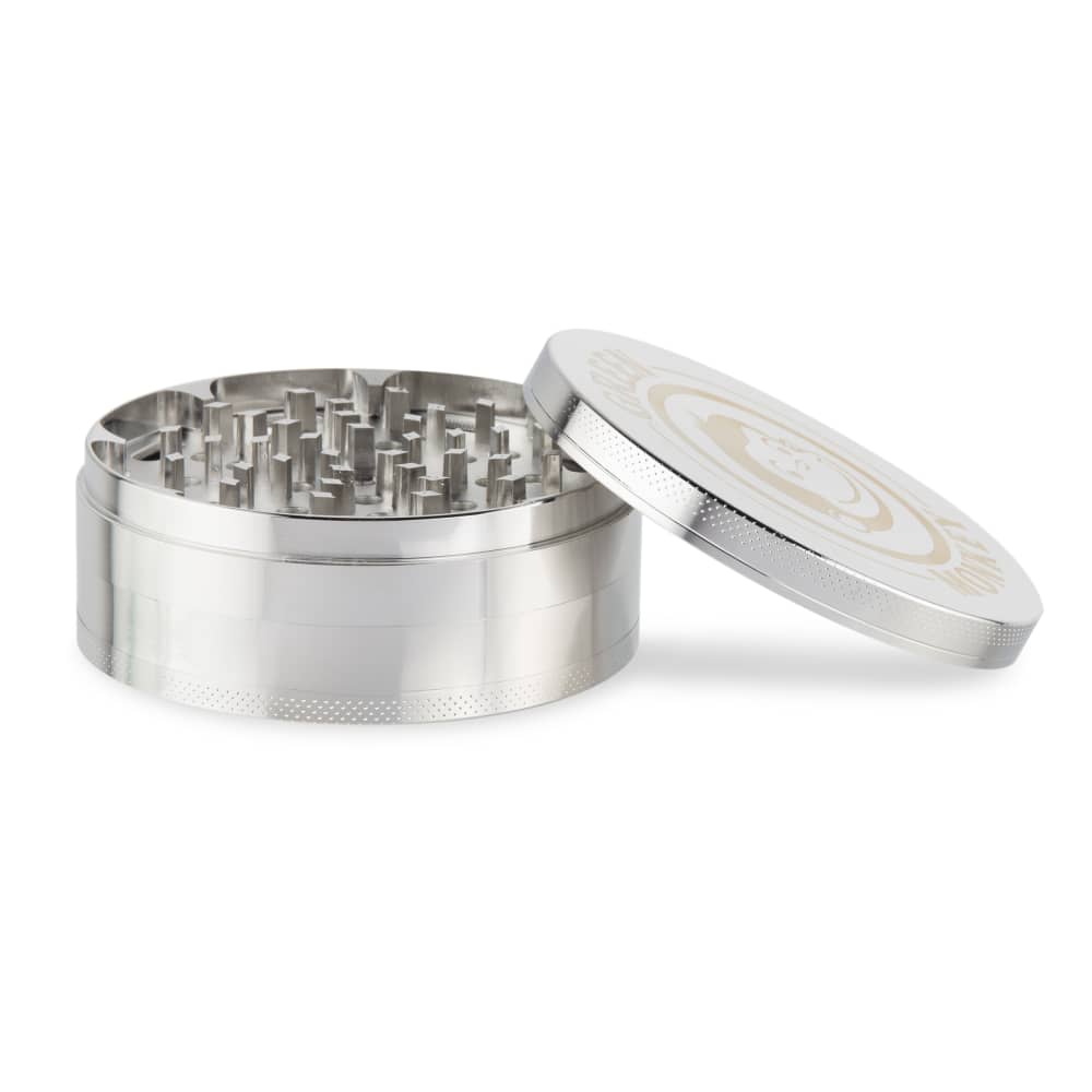 The open Capuchin 100mm Grinder displays its metal grinding teeth from a slightly angled, top-down perspective.