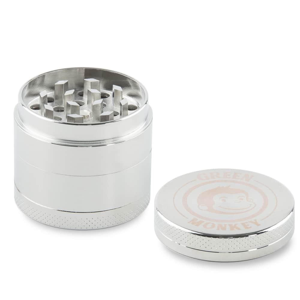 A close-up, angled view of the Capuchin 40mm Grinder, revealing its metallic, multi-tiered construction and open grinding chamber.