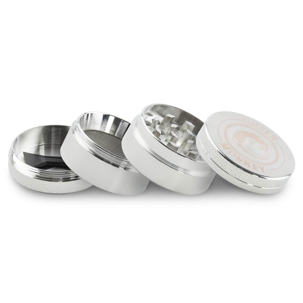 A disassembled view of the Capuchin 40mm Grinder, showcasing its metallic components laid out on a neutral gray background.