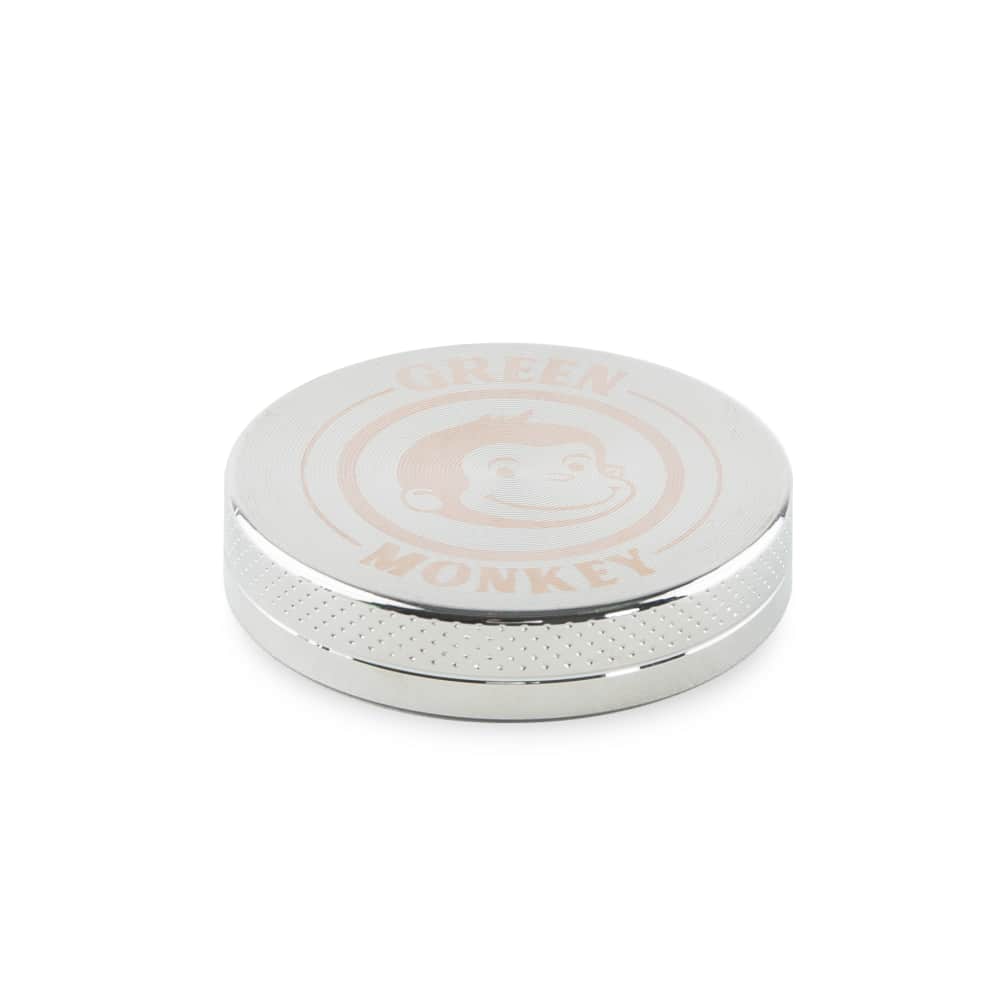Close-up of the Capuchin 40mm Grinder, a silver metal grinder with a textured top surface, shown against a plain white background.
