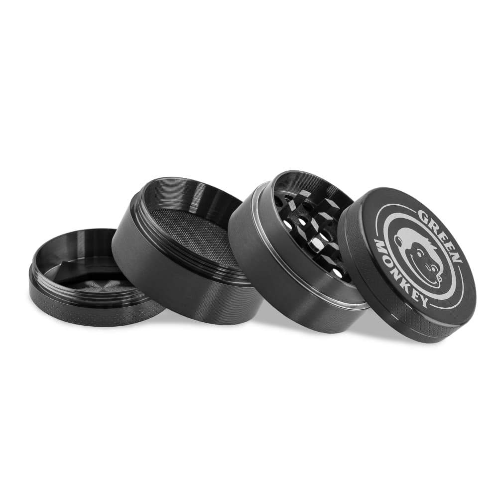Close-up, angled view of the Capuchin 40mm Grinder, showcasing its multiple metallic pieces disassembled on a plain background.