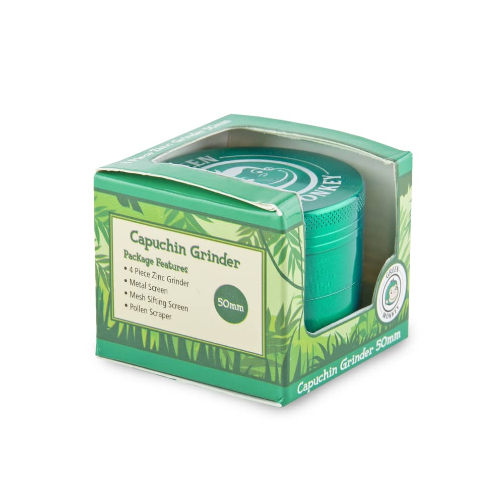 A close-up of the Capuchin 50mm Grinder, showing its metallic finish and branded packaging in a studio shot.