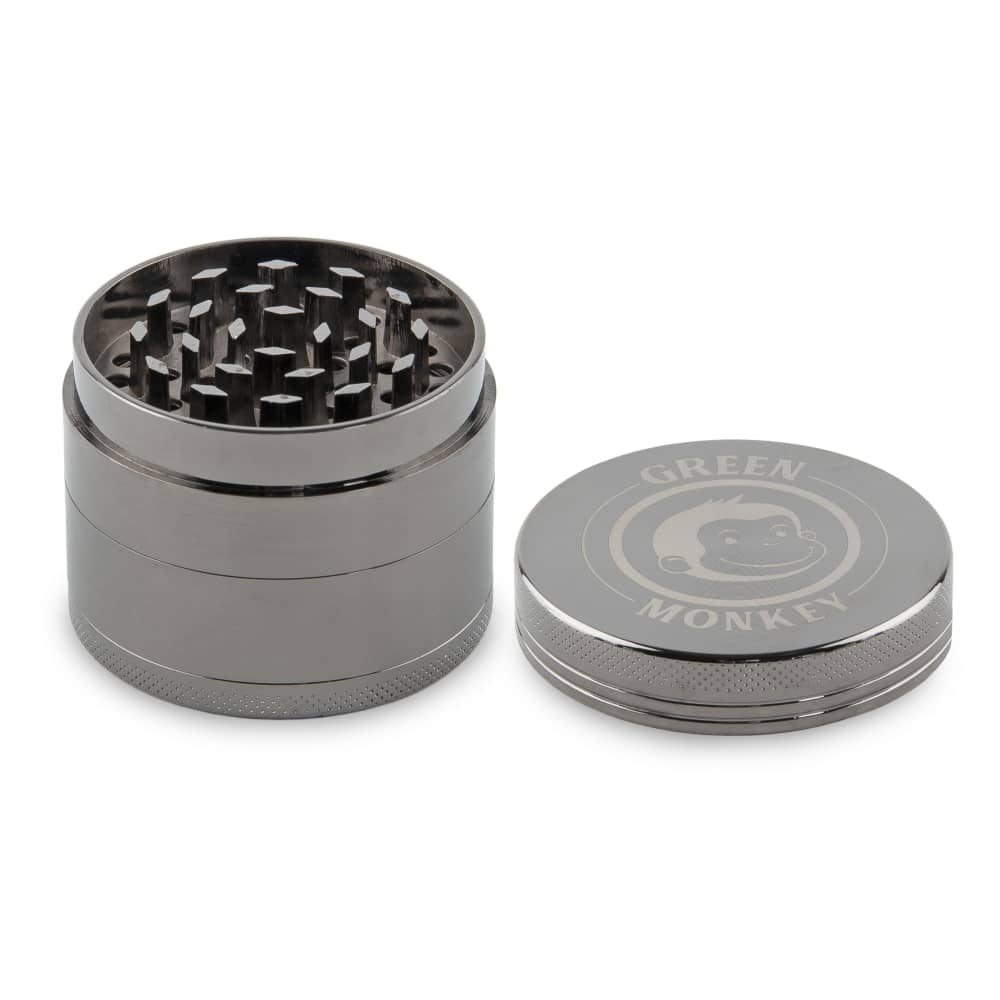 Close-up of the Capuchin 50mm Grinder from a slightly above angle, showing its metallic cylindrical shape and textured top.