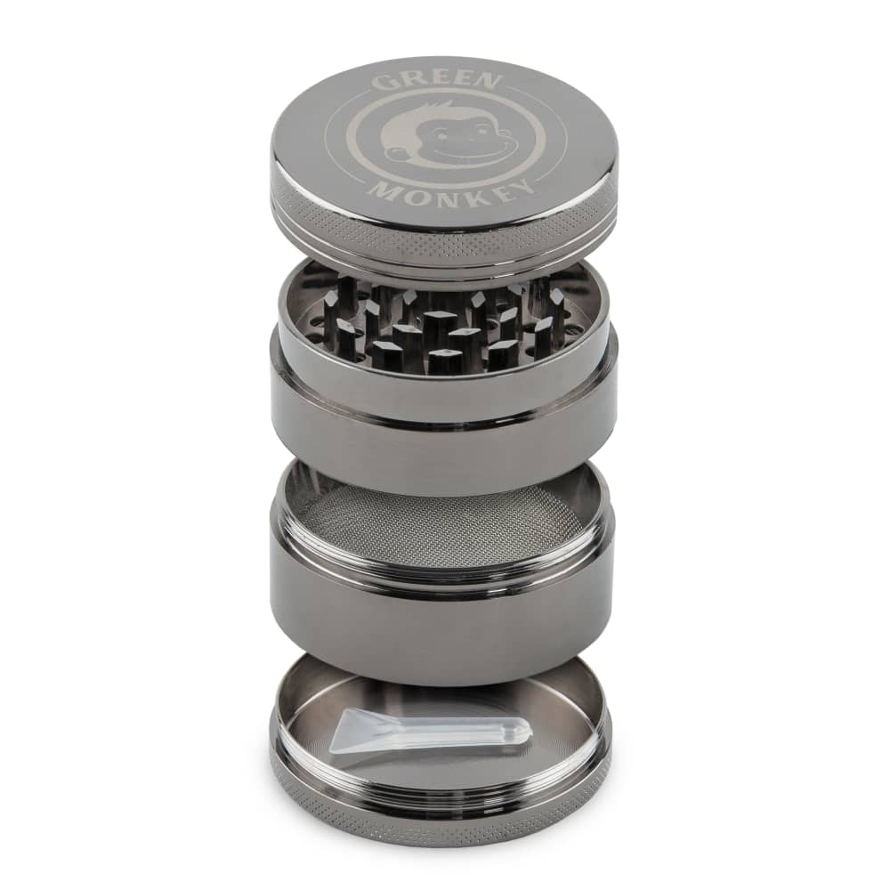 Close-up of the Capuchin 50mm Grinder disassembled, showing its stacked metal components against a plain white background.