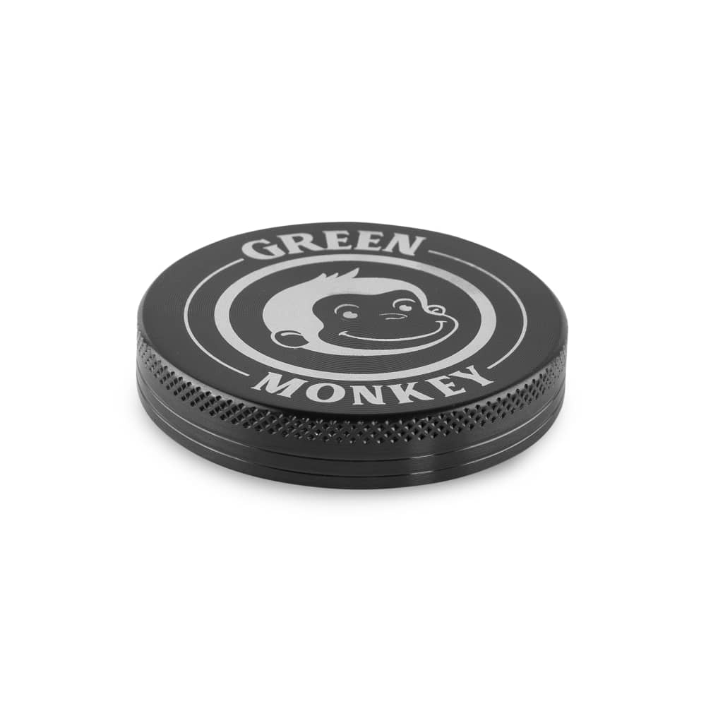 Close-up, top-down view of the Capuchin 55mm Grinder with a sleek, metallic finish and circular design.