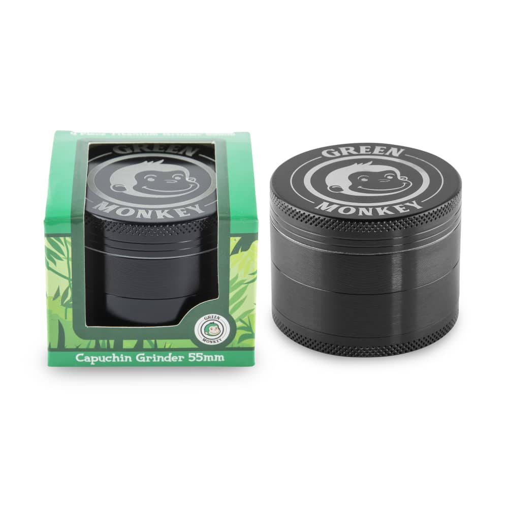 Front view of the Capuchin 55mm Grinder, with a dark finish and branded packaging visible behind it.