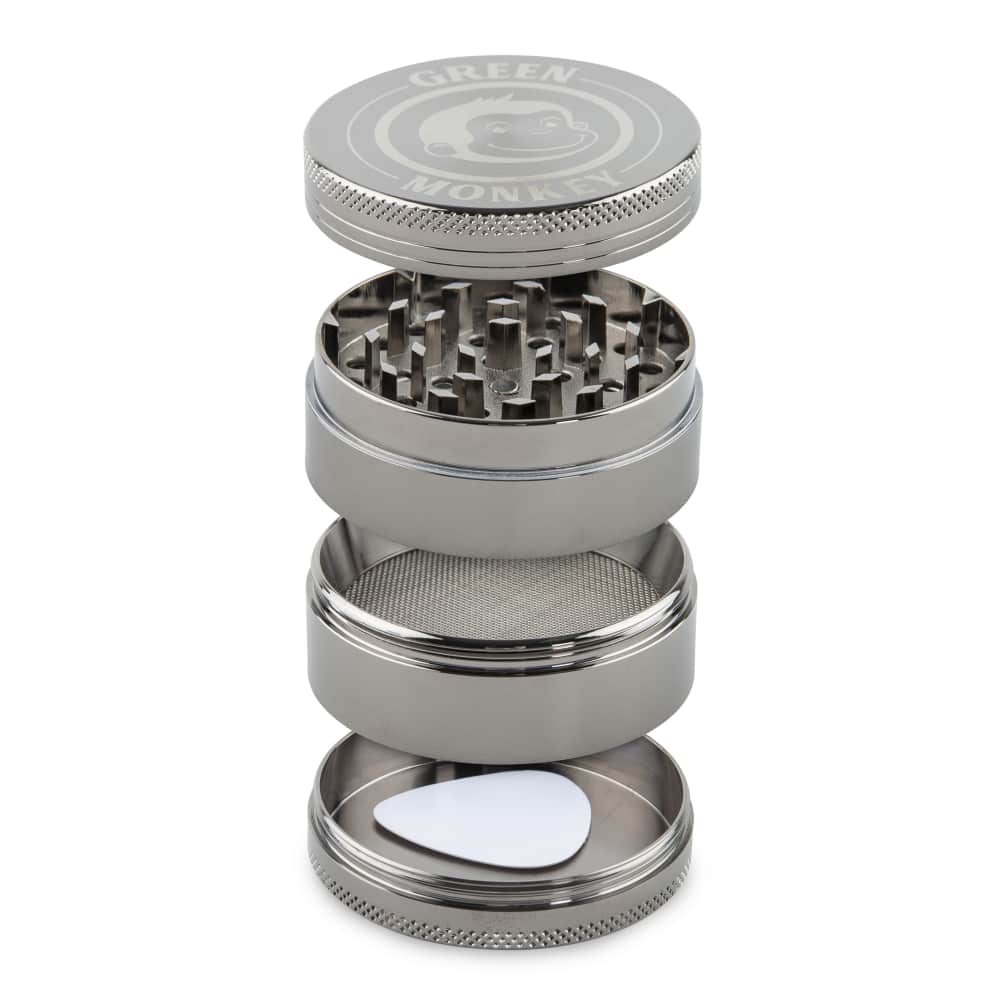 A close-up of the disassembled Capuchin 55mm Grinder, showing the metallic components stacked on a white surface.