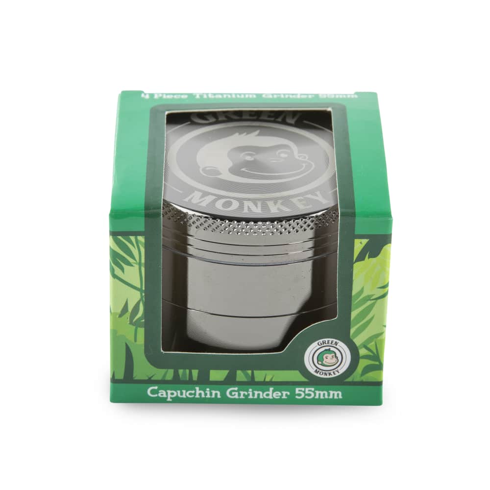 Front view of the Capuchin 55mm Grinder, with a metallic finish and circular design, against a dark backdrop.