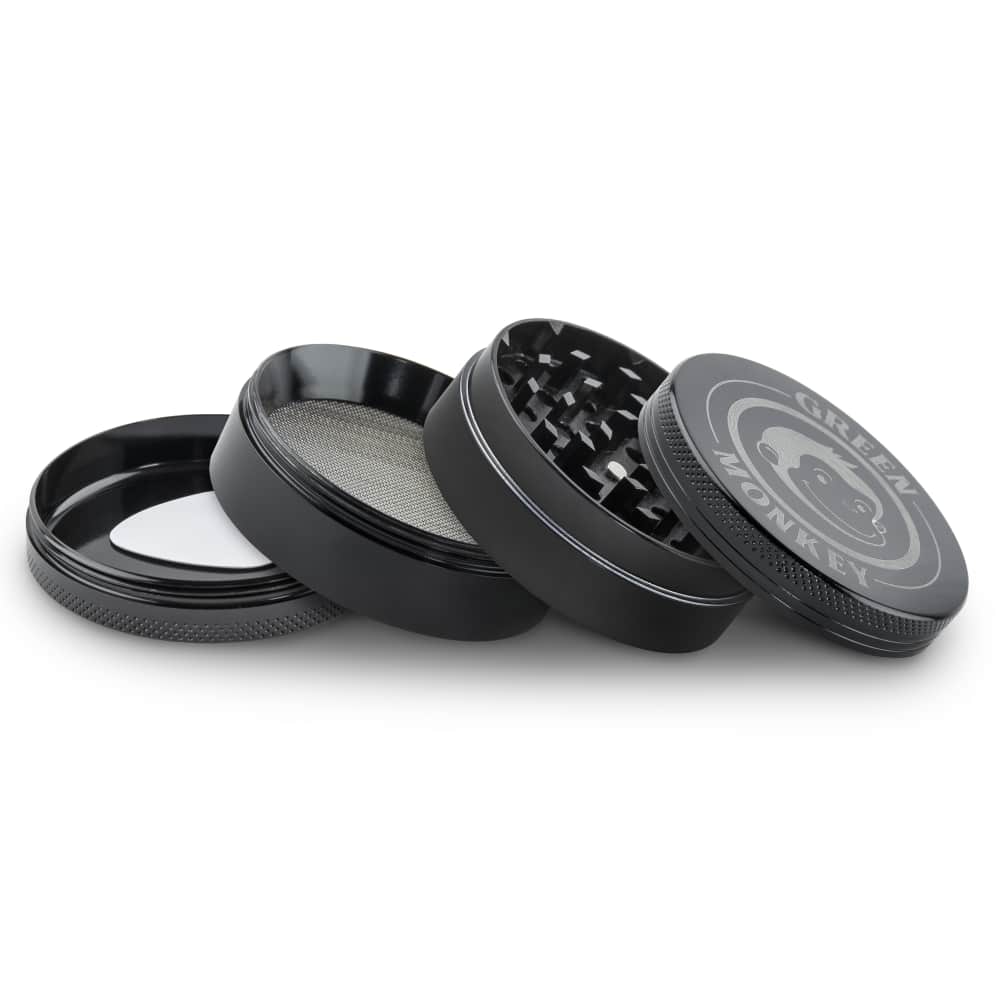 The Capuchin 63mm Grinder is shown disassembled in a flat lay, revealing its multi-tiered, silver-toned metallic components.