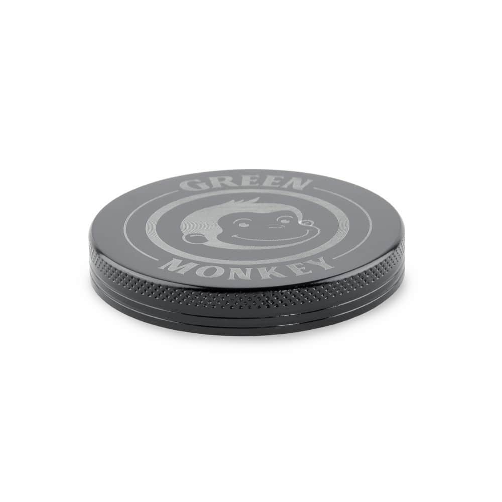 Overhead view of the Capuchin 63mm Grinder, a silver metallic disc with a smooth, circular design.
