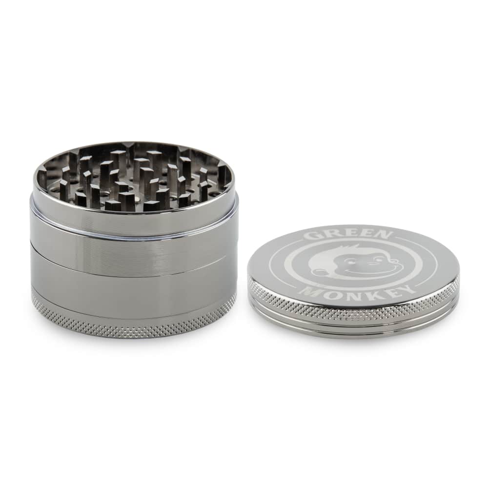 A close-up, angled view of the Capuchin 63mm Grinder, showcasing its multi-tiered silver metallic construction.