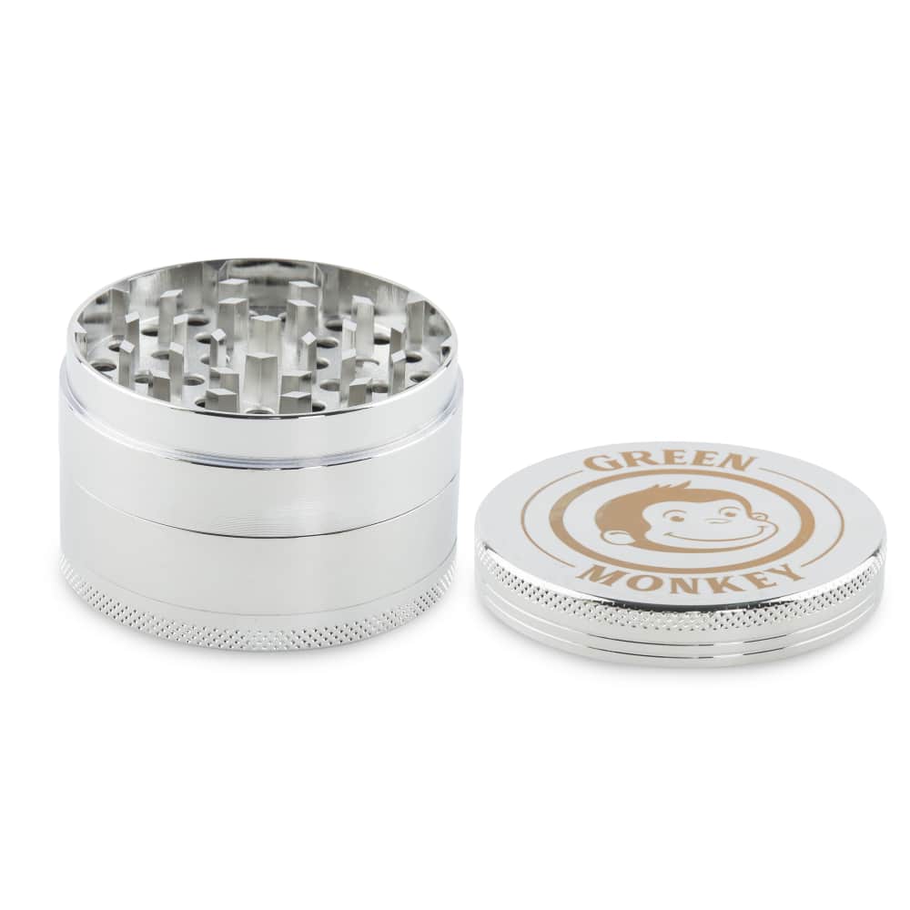 Front view of the Capuchin 63mm Grinder, a silver metal grinder with a multi-tiered interior visible at the top.