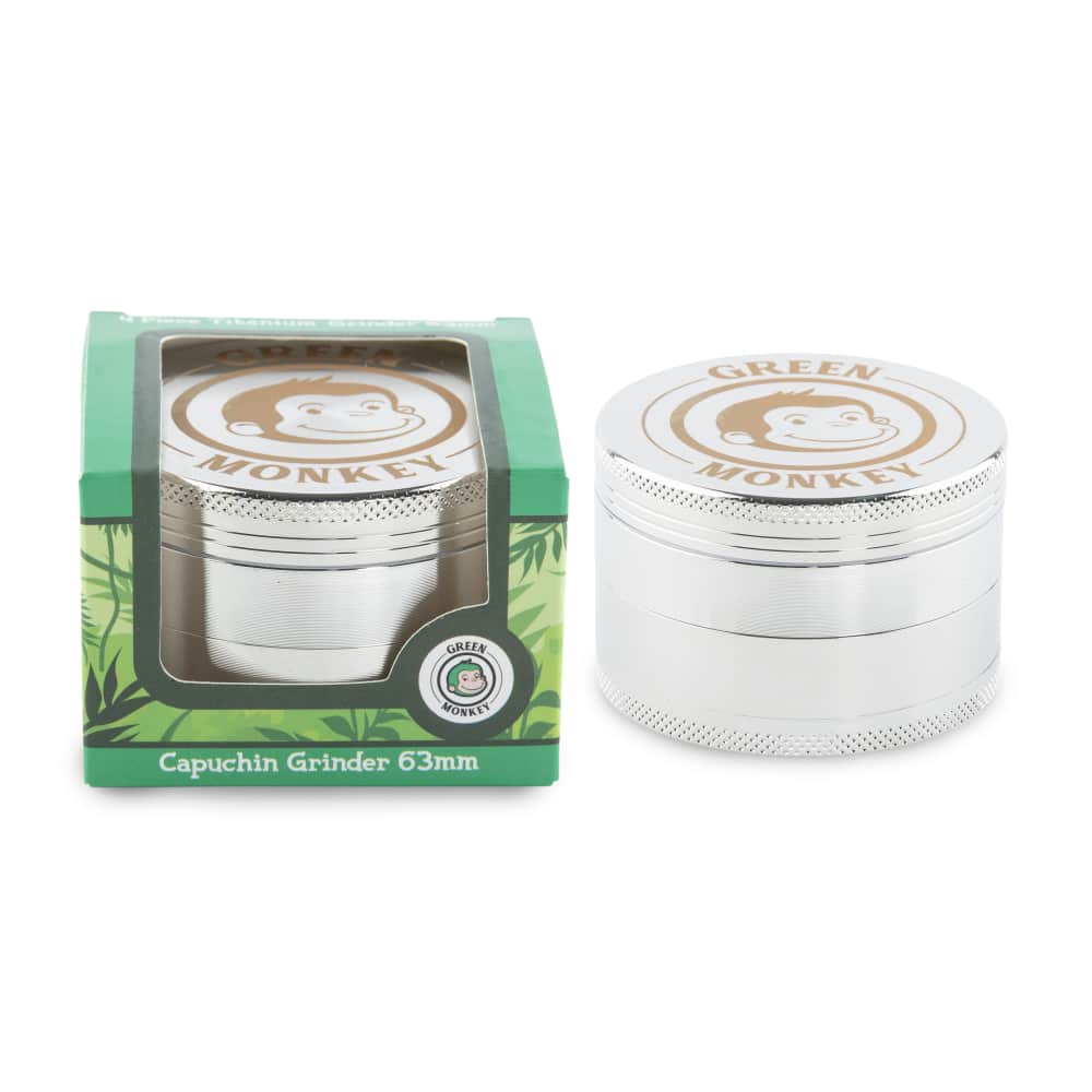 A close-up, angled view of the Capuchin 63mm Grinder, showing its metallic finish and circular design.