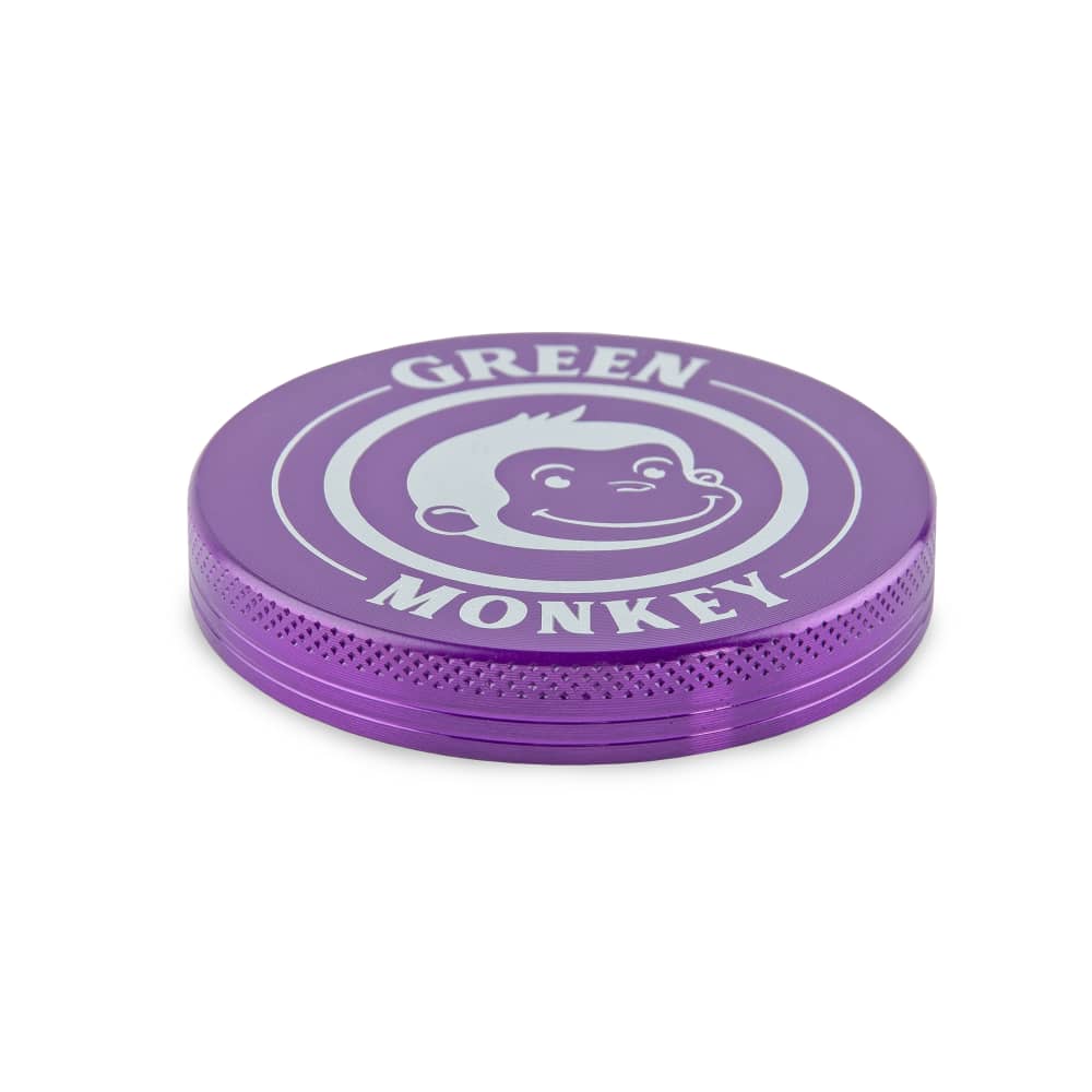 Close-up of the Capuchin 63mm Grinder, showcasing its metallic purple finish and circular design.