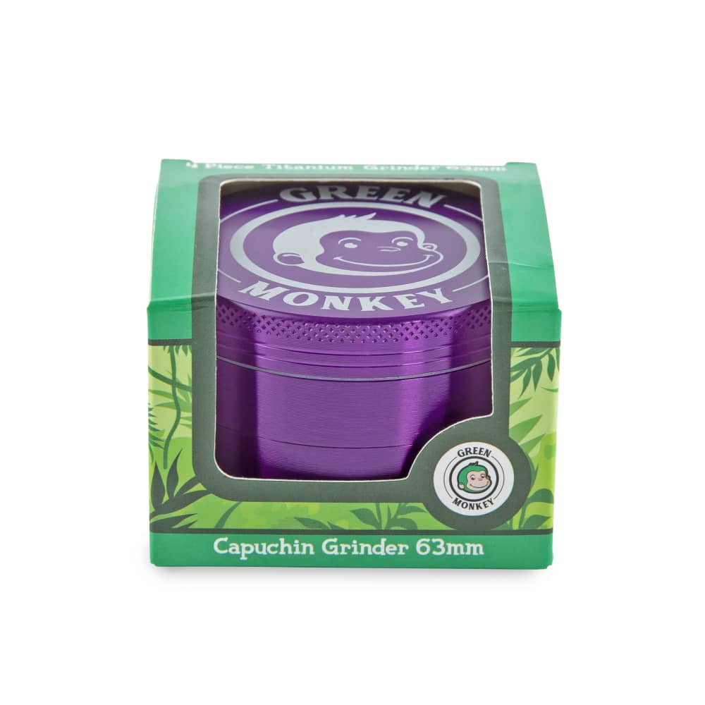 Front view of the Capuchin 63mm Grinder, showcasing its purple metallic finish and circular shape against a plain background.