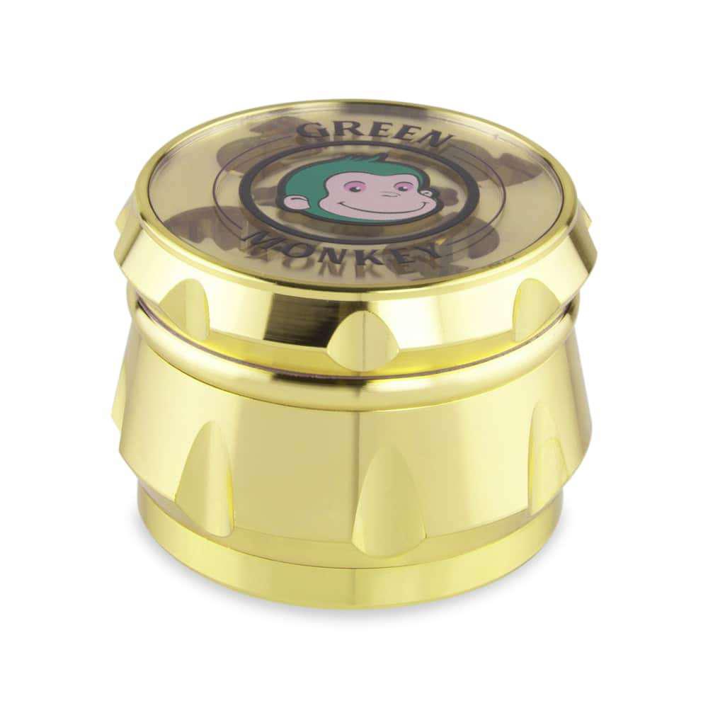 Front view of the Baboon Crown 63mm Grinder, a metallic, multi-tiered cylindrical device with visible teeth.