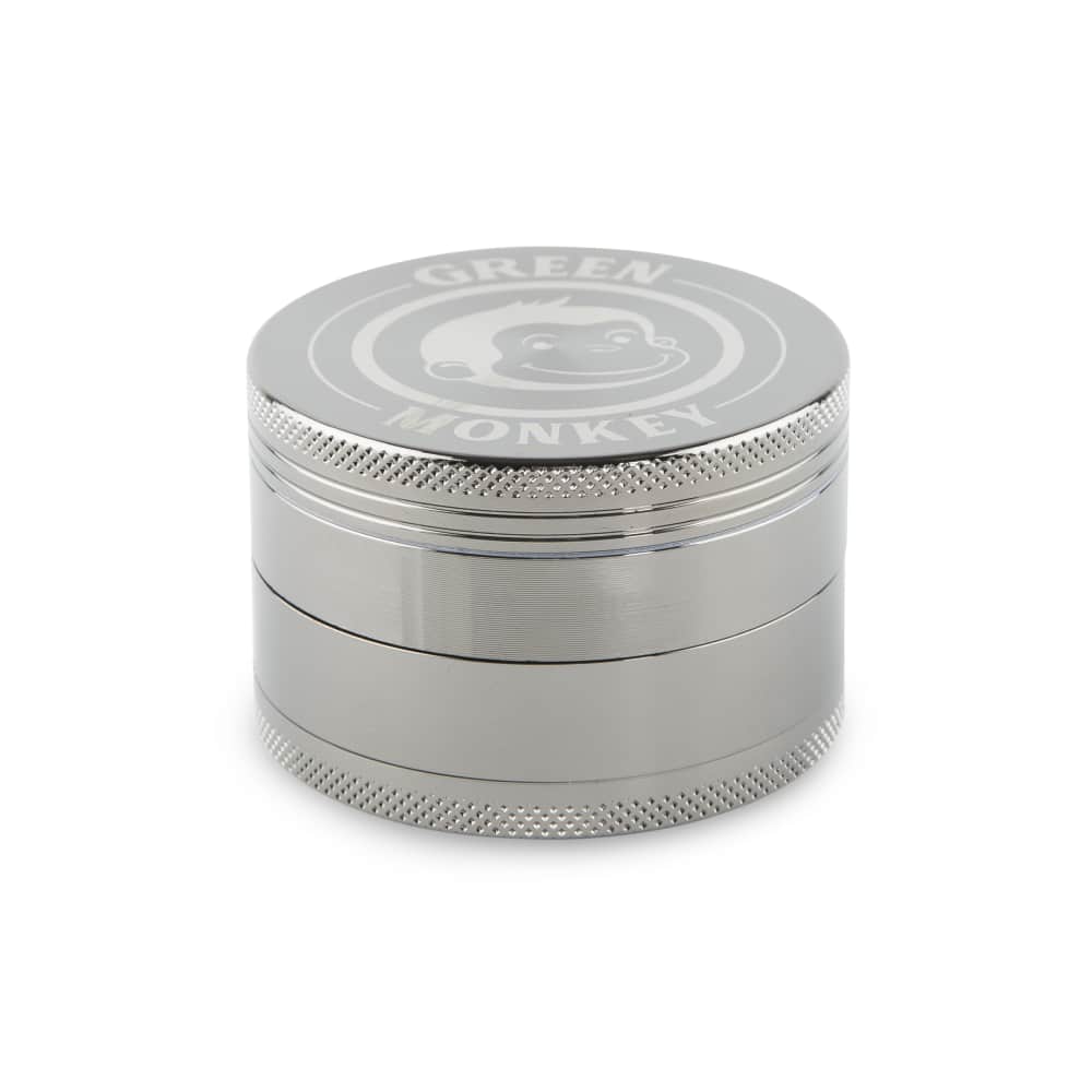 A close-up, angled view of the Capuchin 63mm Grinder, displaying its metallic, multi-tiered construction against a plain white backdrop.
