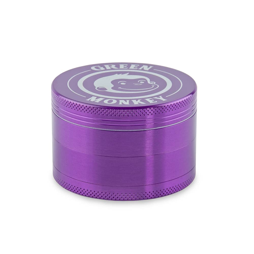 Front view of the Capuchin 63mm Grinder, a metal grinder with a textured surface, set against a dark background.