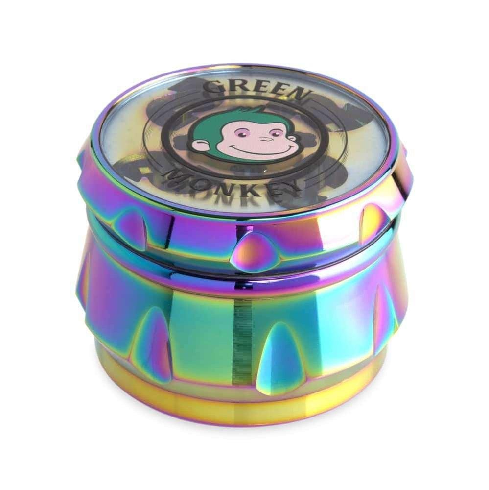 A close-up, angled view of the Baboon Crown 63mm Grinder showing its metallic, multi-toned finish.