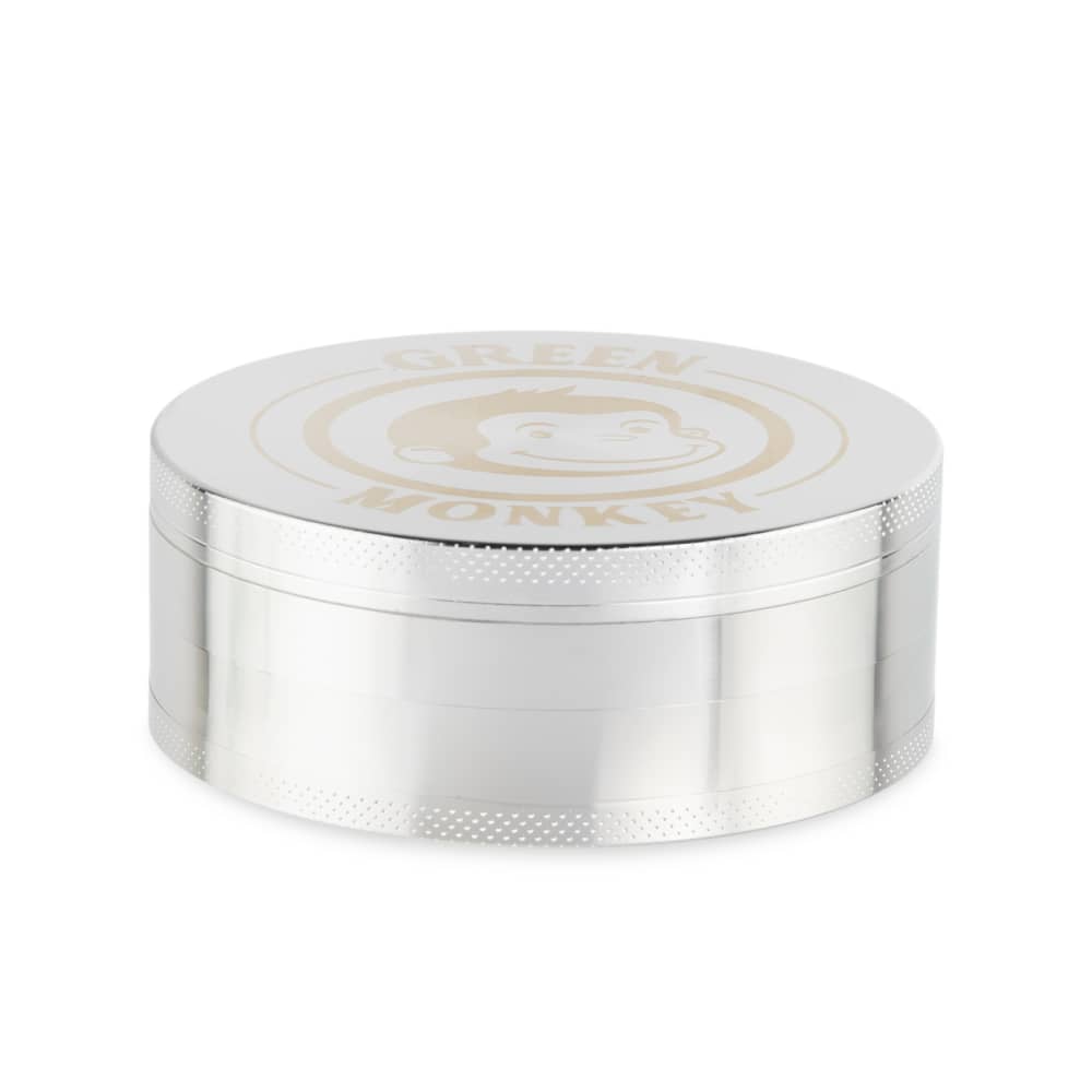 A close-up, angled view of the Capuchin 100mm Grinder, featuring a metallic, cylindrical shape with textured layers.