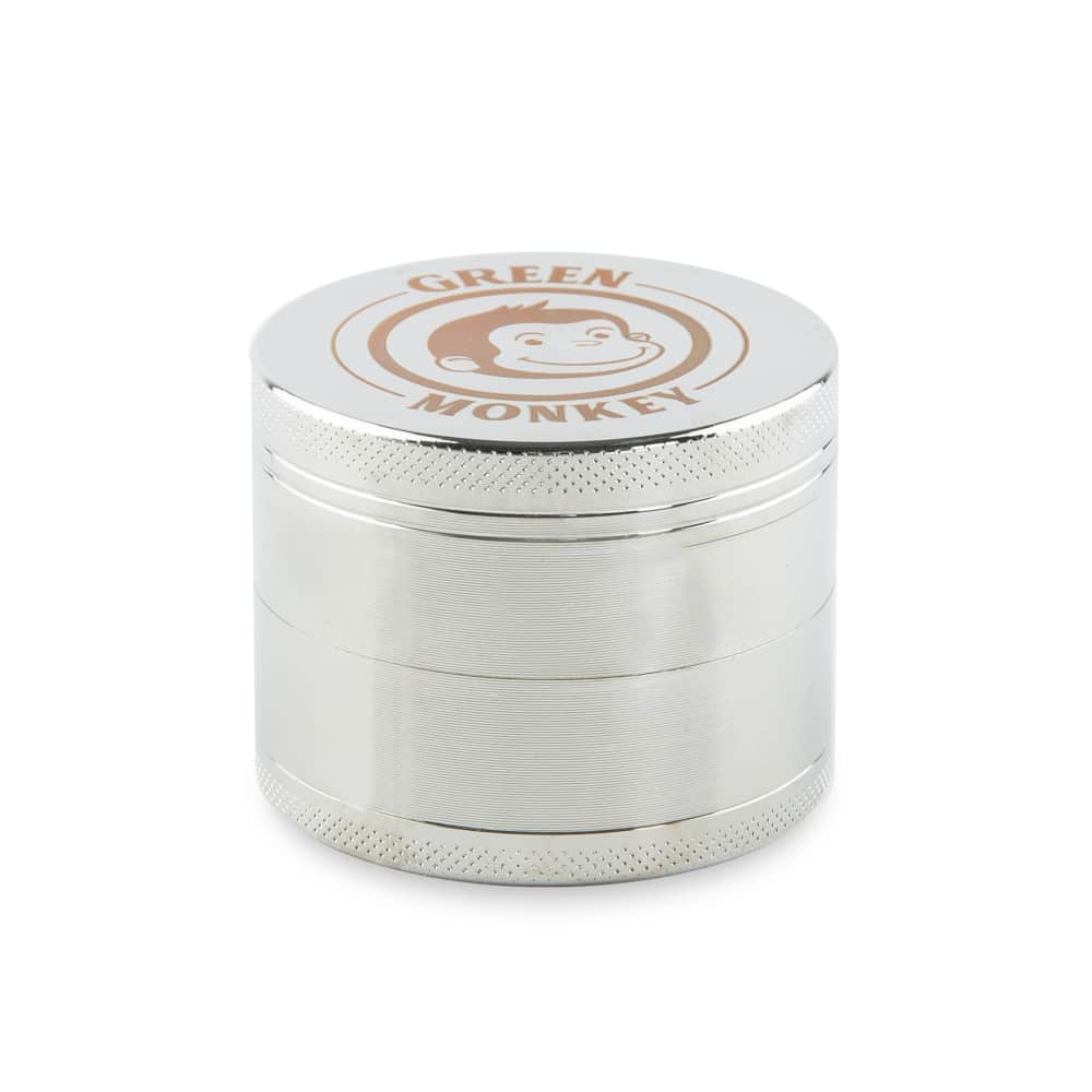 A close-up, angled view of the Capuchin 50mm Grinder, showcasing its metallic, multi-tiered construction and textured surface.