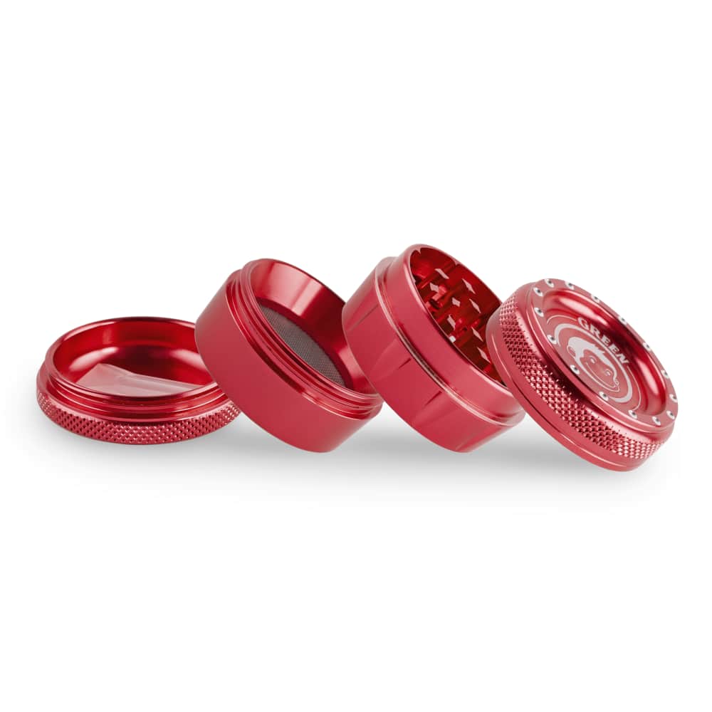 A close-up, angled view of the disassembled Tamarin 50mm Grinder, showing its metallic components against a plain white backdrop.