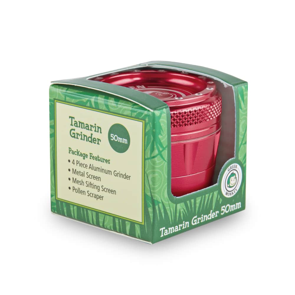 A close-up of the Tamarin 50mm Grinder, showing its metallic finish and simple cylindrical shape against a black background.