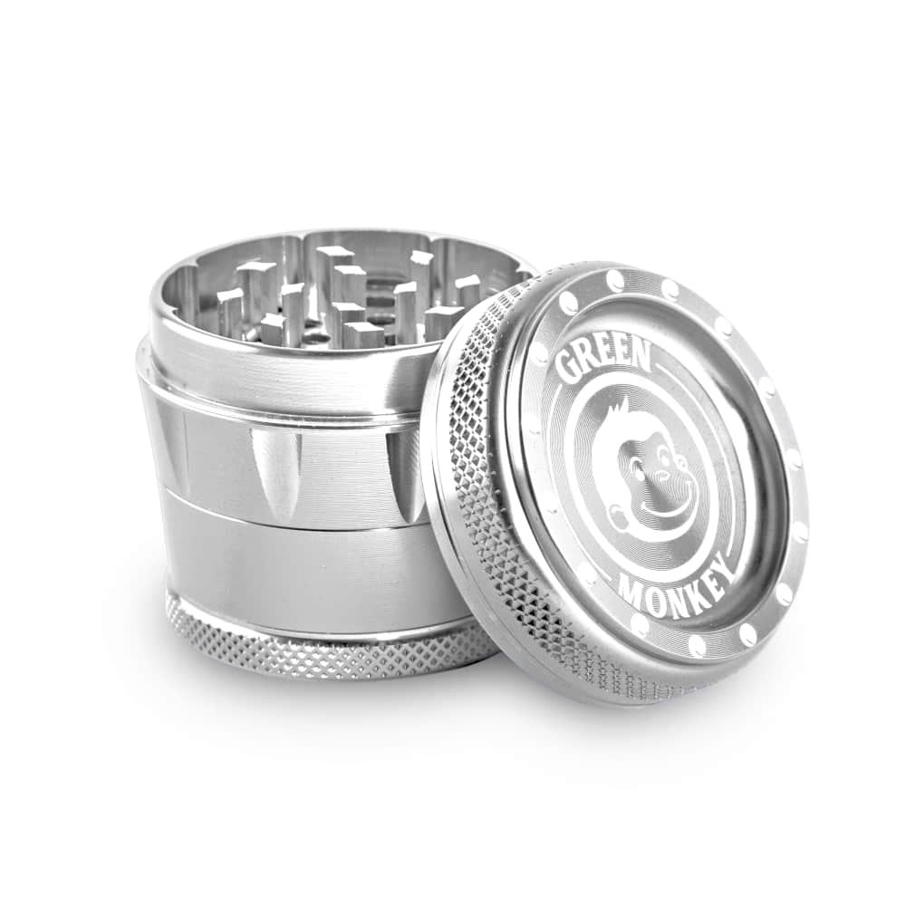 Close-up of the Tamarin 50mm Grinder, displaying its metallic construction and open grinding chamber against a plain white background.