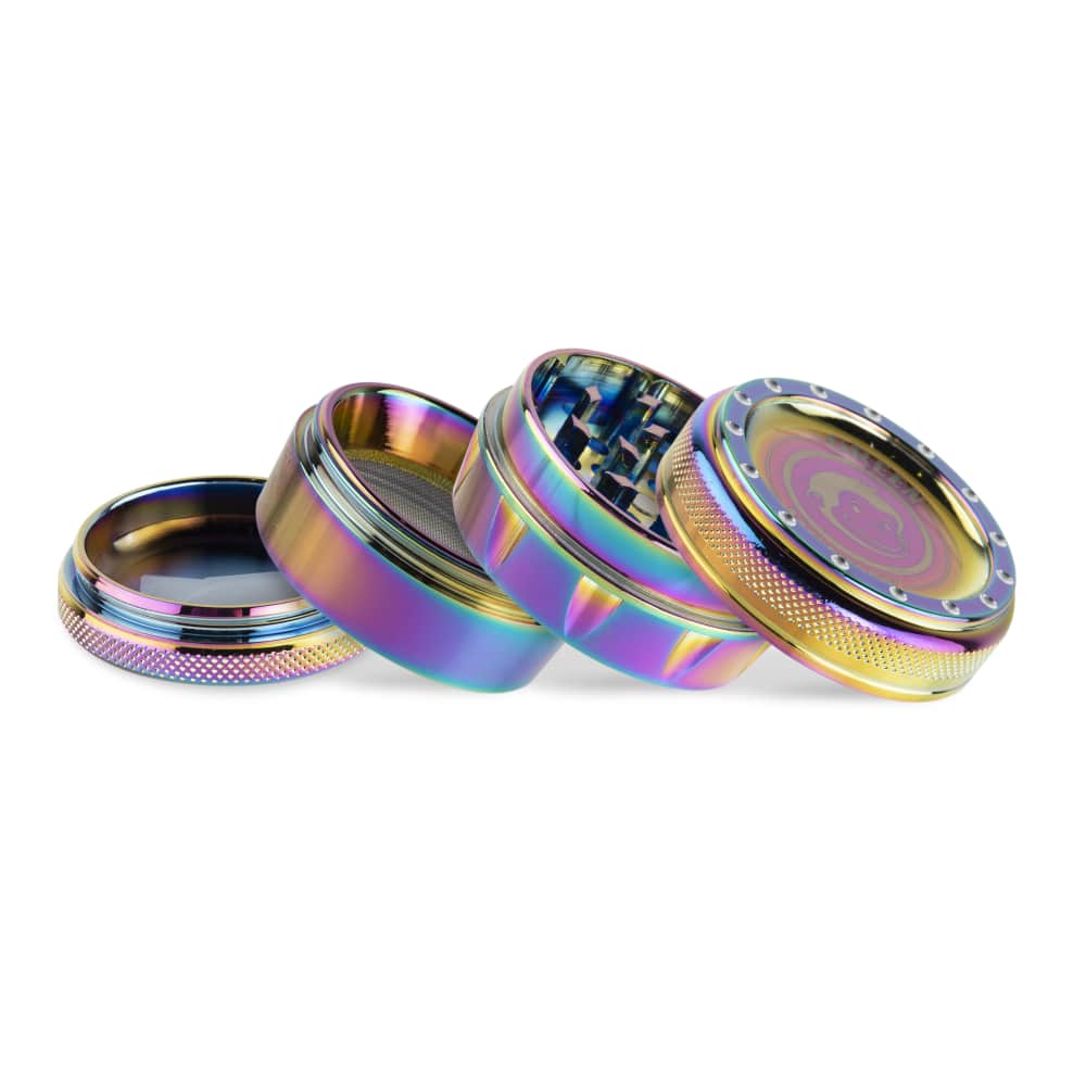 A close-up, angled view of the disassembled Tamarin 50mm Grinder, showcasing its metallic, multi-toned finish and internal components.