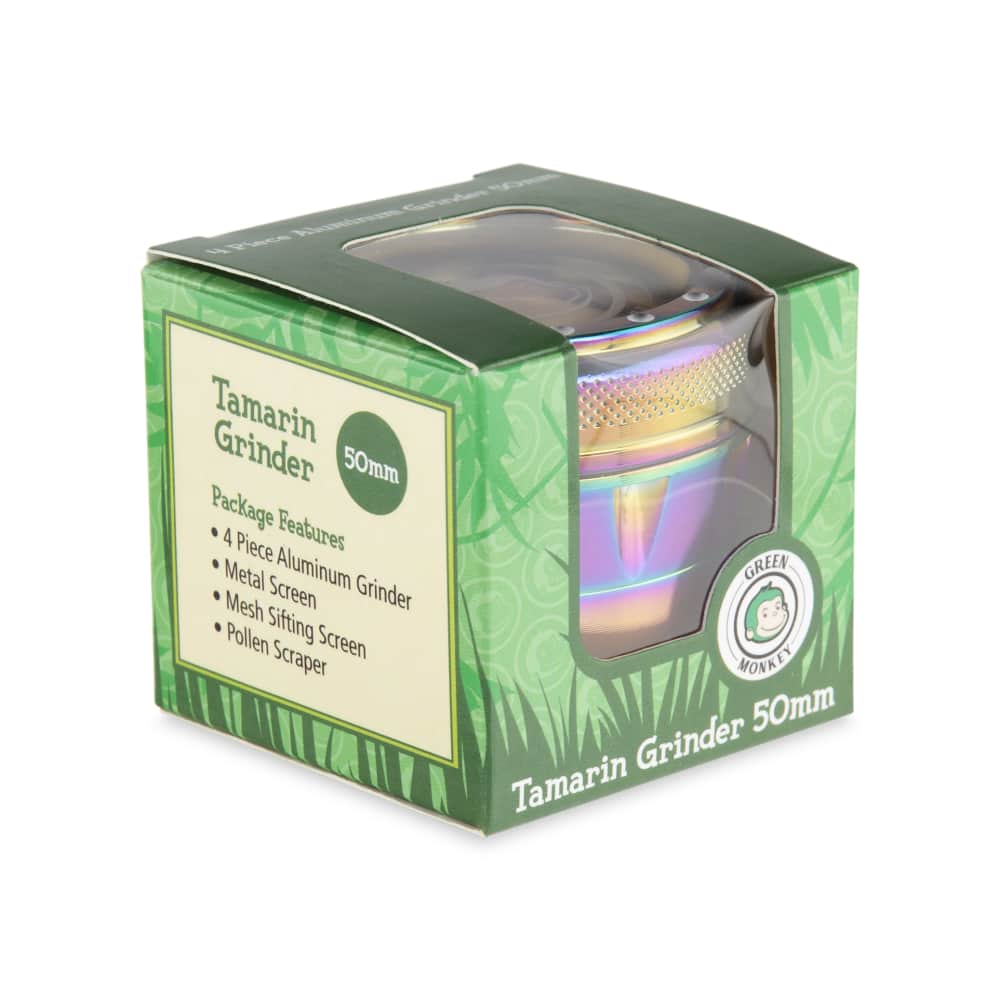 A close-up of the Tamarin 50mm Grinder, showcasing its metallic finish and cylindrical shape against a dark background.