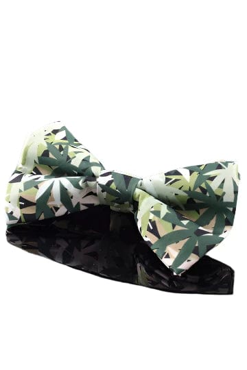 A close-up shot of the Pet Bow Tie, a stylish accessory with a patterned design, against a dark reflective surface.
