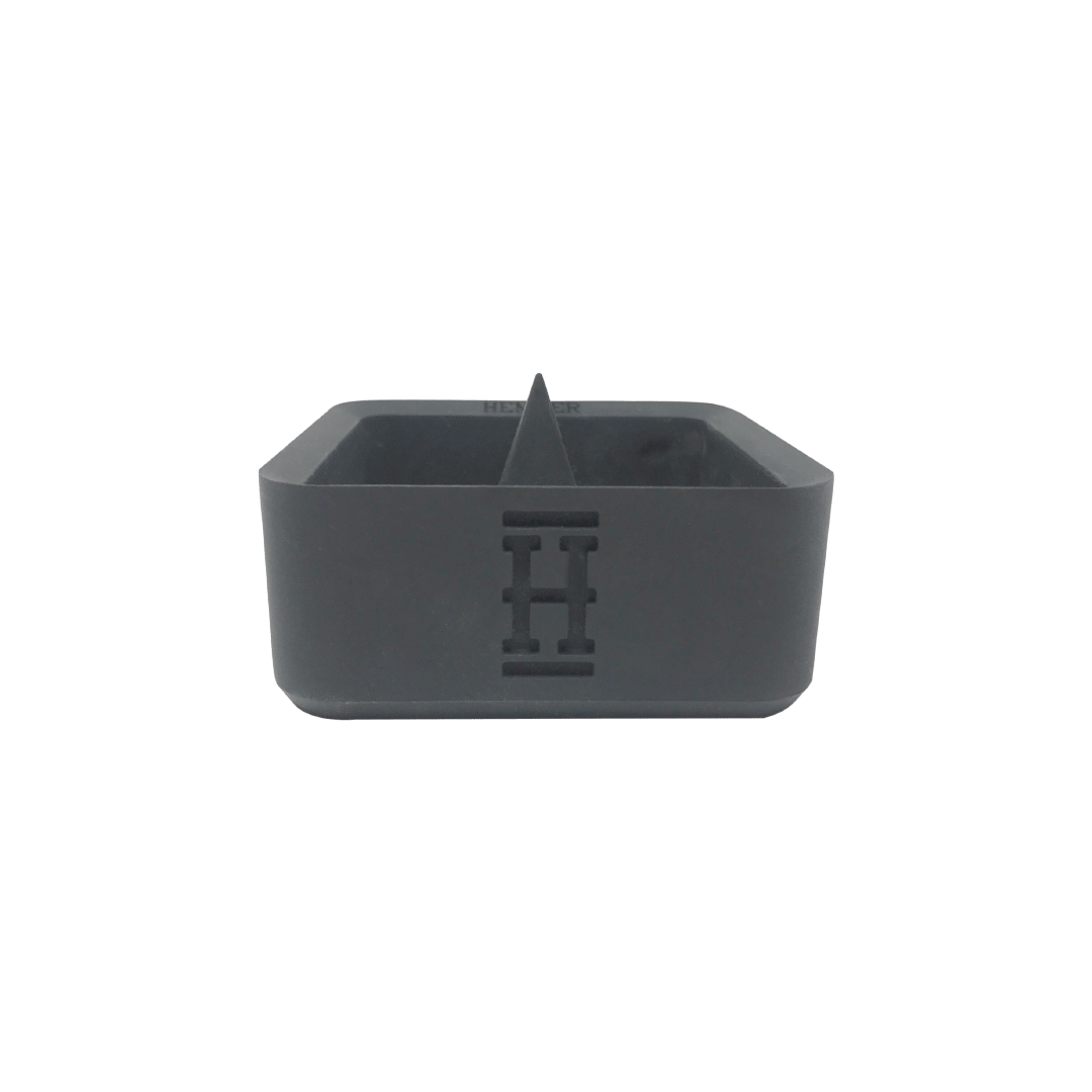 A top-down view of the Silicone Caché Debowling Ashtray, showcasing its simple, dark-colored bowl design.