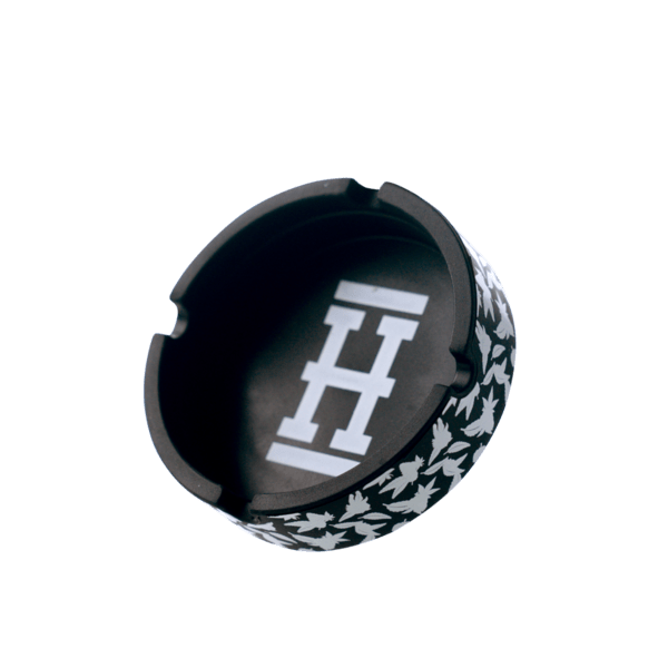 A top-down view of the Asher "Cannaflage" Silicone Ashtray, showcasing its circular shape and camouflage pattern on a white background.
