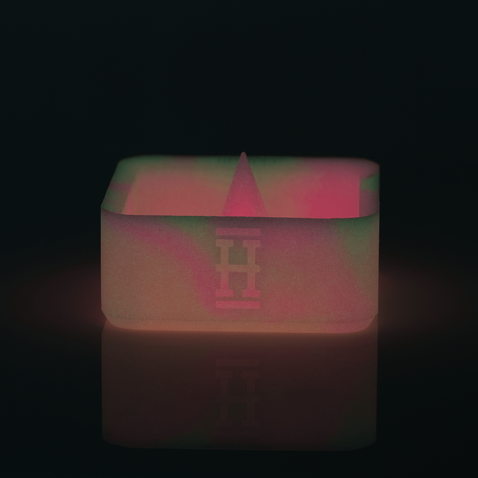 Front view of the Silicone Caché Debowling Ashtray, a smooth, red silicone bowl against a dark backdrop.