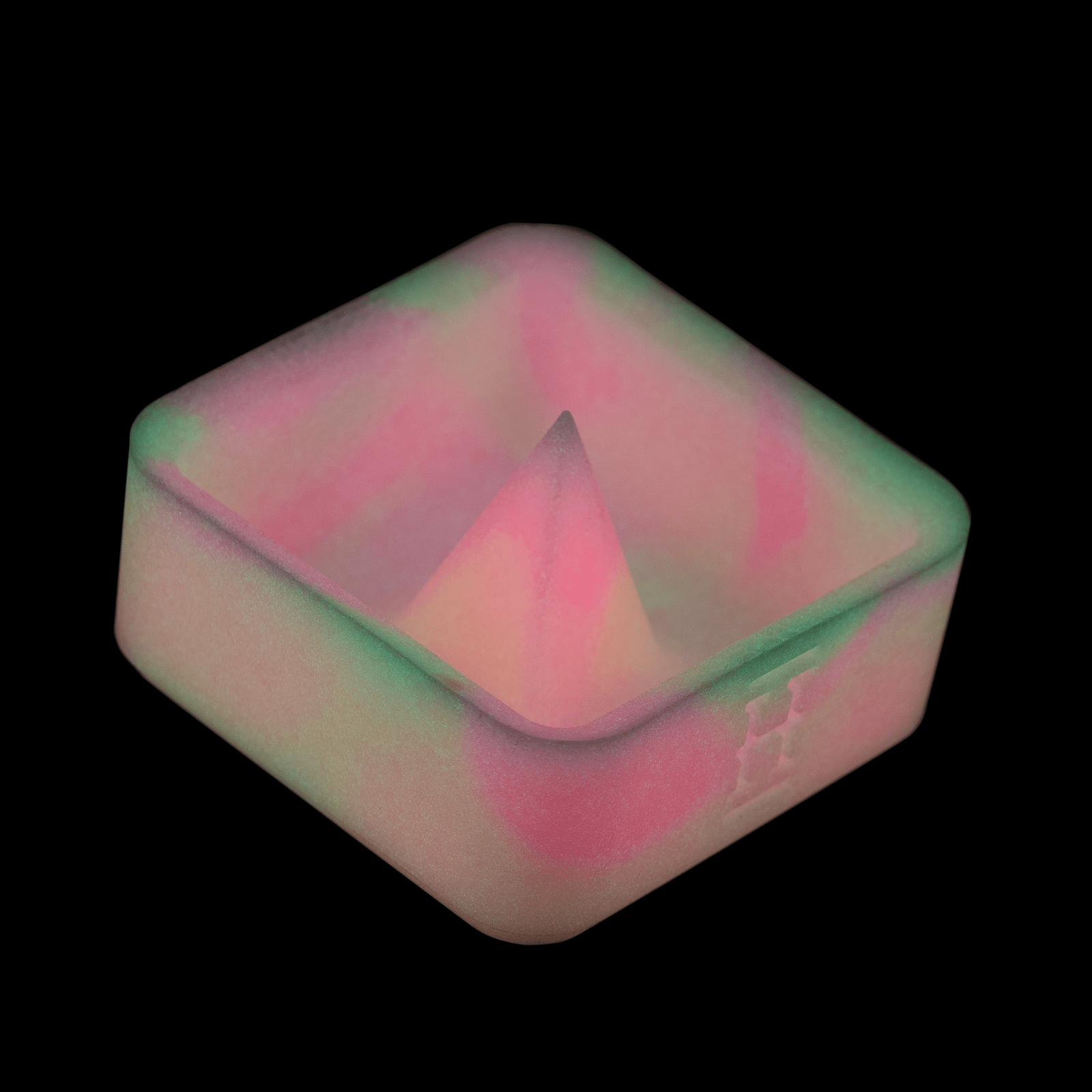 A high-angle view of the Silicone Caché Debowling Ashtray, showcasing its smooth, curved form and subtle sheen.