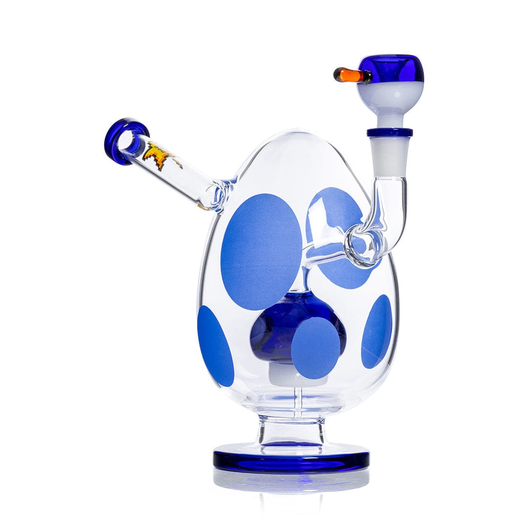 Front three-quarter view of the Hemper Spotted Egg XL Bong showing its egg-shaped clear glass body with large blue spots, matching blue-rimmed mouthpiece and bowl.