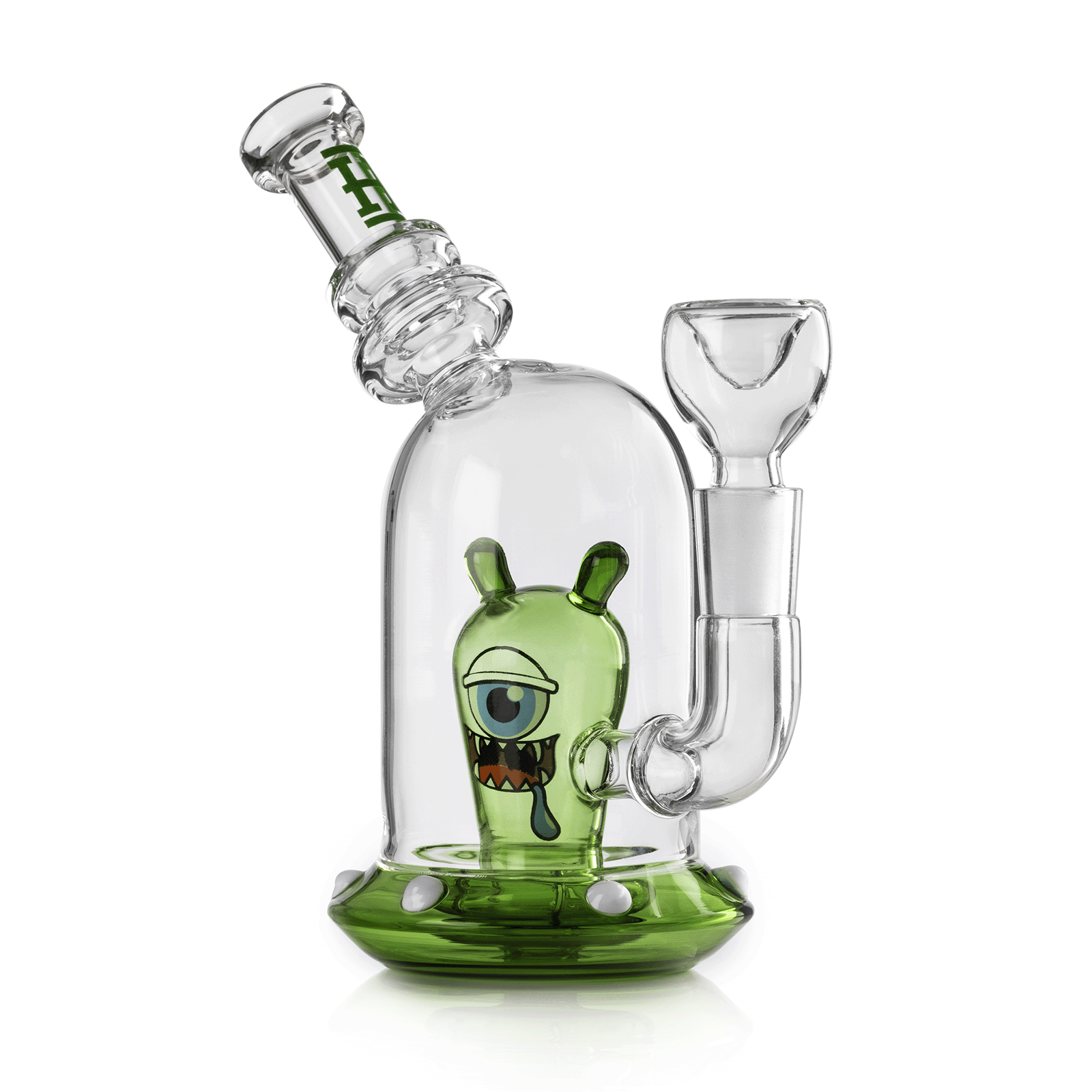 Three-quarter front view of the clear and green Space Monster Bong 7" showing a cyclopean green monster inside and the angled mouthpiece.