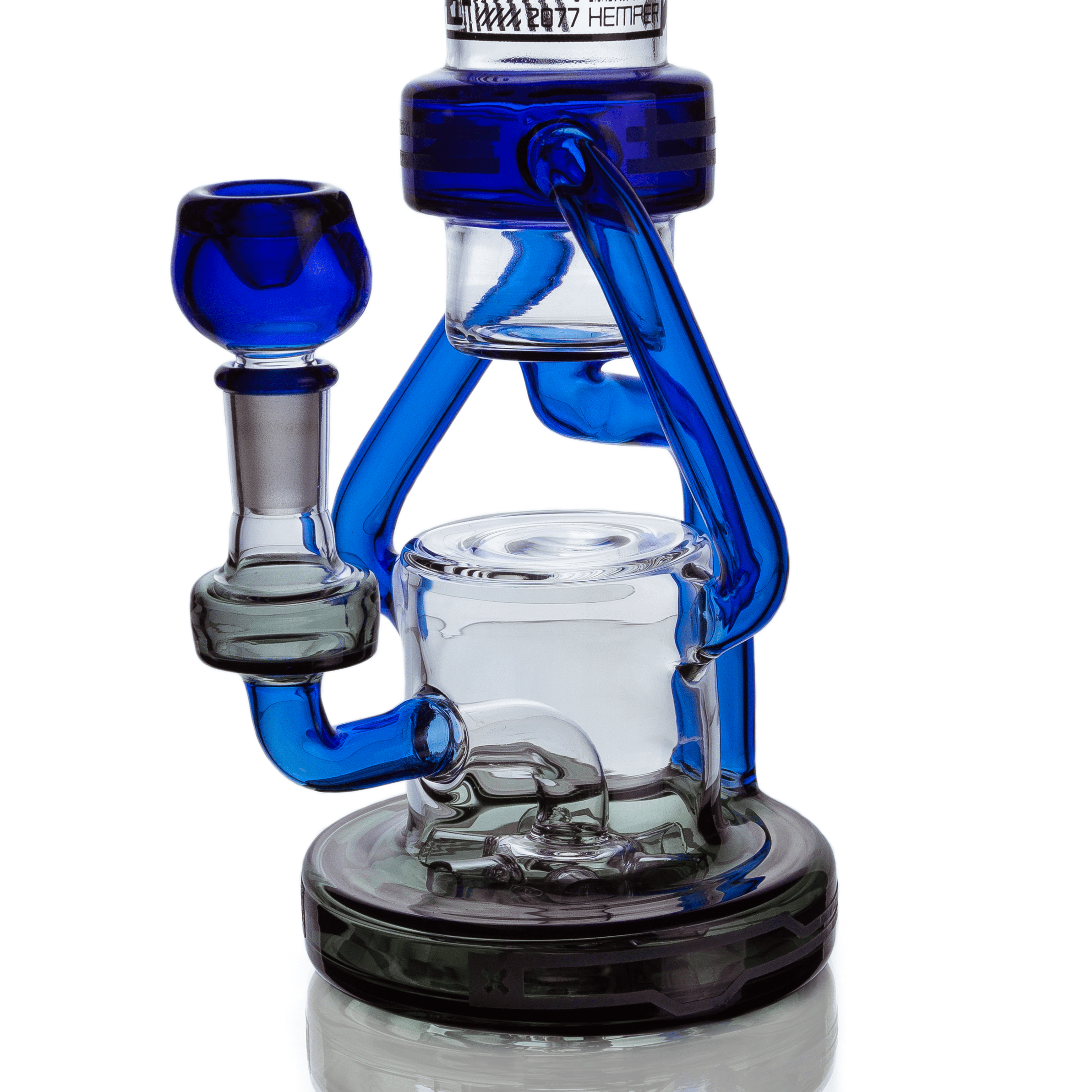 Close-up angled view of the blue glass Hemper Cyberpunk XL Recycler Bong showing its bowl, curved recycler tubes, and clear water chamber.